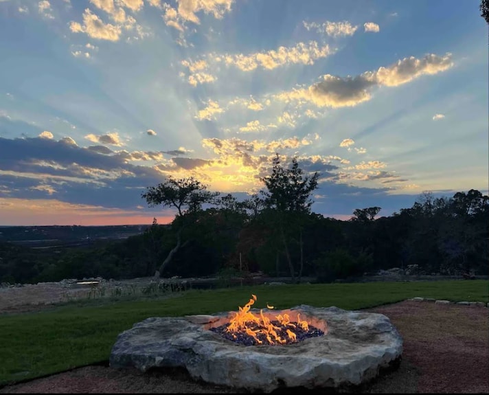A Hill Country fire pit area built around sealed stone.
