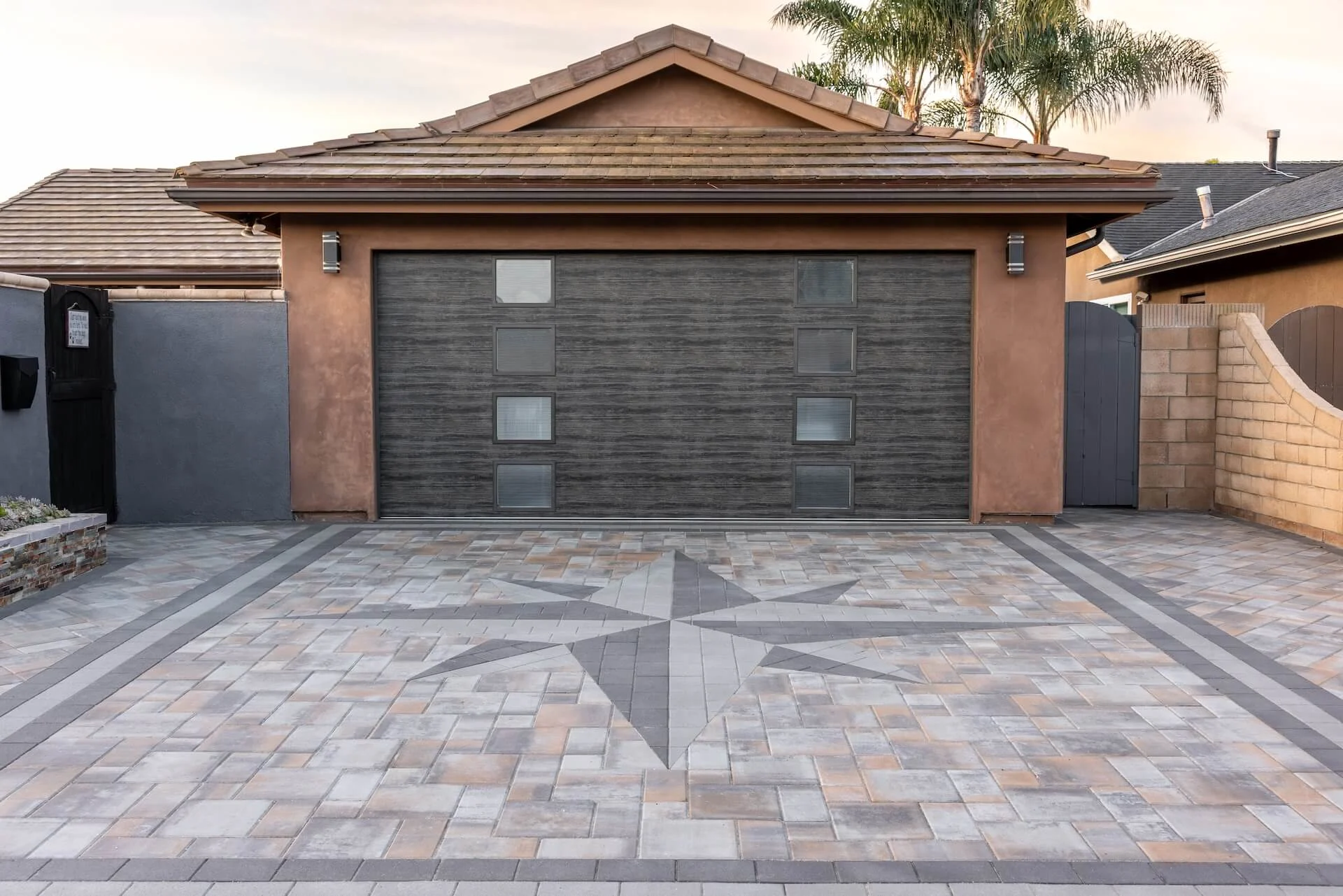 A paver driveway sealed for curb appeal and easier washing.